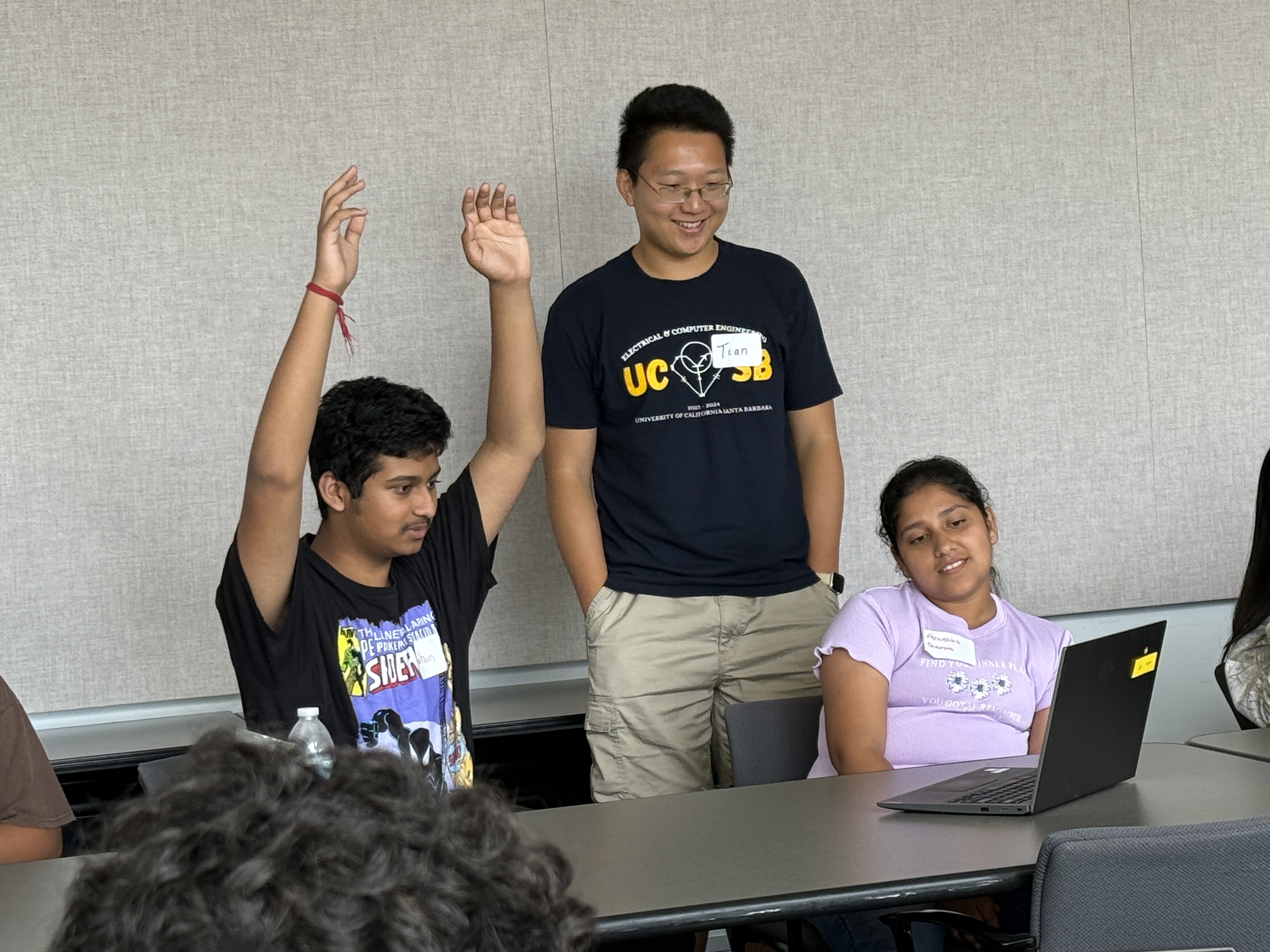 Students collaborating on AI projects